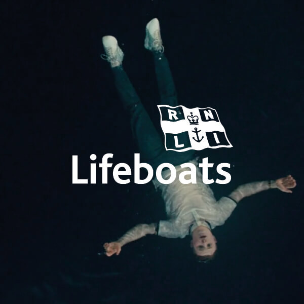 RNLI Lifeboats Logo With Man Floating In Water